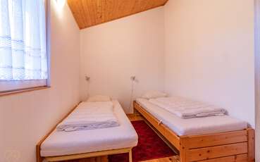 Schlafzimmer mit zwei Einzelbetten Ferienhaus Lilla Ryd