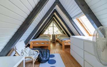 Schlafloft mit zwei Einzelbetten Ferienhaus Nyehusen