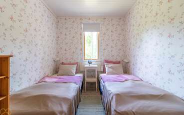 Schlafzimmer mit zwei Einzelbetten Ferienhaus Björktorpet