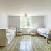 Schlafzimmer mit zwei Einzelbetten Ferienhaus Fösingsmåla