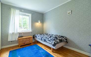 Schlafzimmer mit Einzelbett Ferienhaus Grimmered