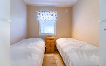 Schlafzimmer mit zwei Einzelbetten Ferienhaus Listerby