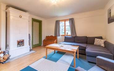 Wohnzimmer mit Kamin Ferienhaus Louisa