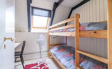 Schlafzimmer mit Etagenbett Ferienhaus Nyehusen