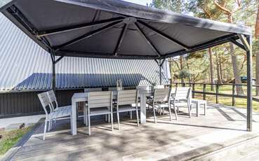 Terrasse mit überdachtem Tisch Ferienhaus Nyehusen