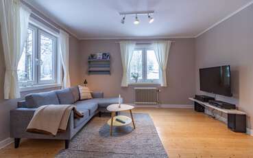 Wohnzimmer mit TV Ferienhaus Påsklilja