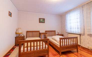 Schlafzimmer mit zwei Einzelbetten Ferienhaus Quade