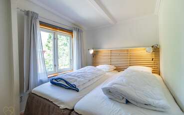 Schlafzimmer mit zwei Einzelbetten Ferienhaus Rinkaby