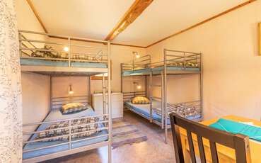 Schlafzimmer mit zwei Etagenbetten Ferienhaus Rullamålen
