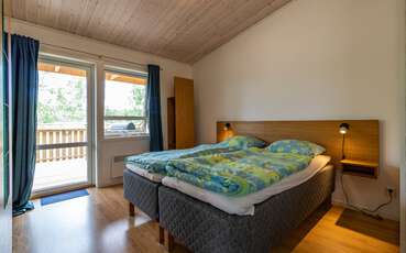 Schlafzimmer mit Doppelbett Ferienhaus Sandviksudden