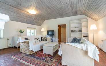 Wohnzimmer mit TV Ferienhaus Södra Kvarn