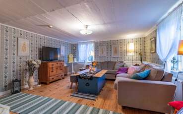Wohnzimmer mit TV Ferienhaus Staby