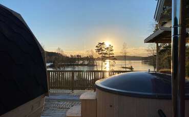 Badefass mit Seeblick Ferienhaus Stenhult