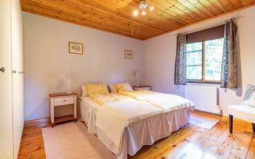 Schlafzimmer mit Doppelbett Ferienhaus Tallstuga