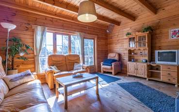 Wohnbereich mit TV Ferienhaus Toven